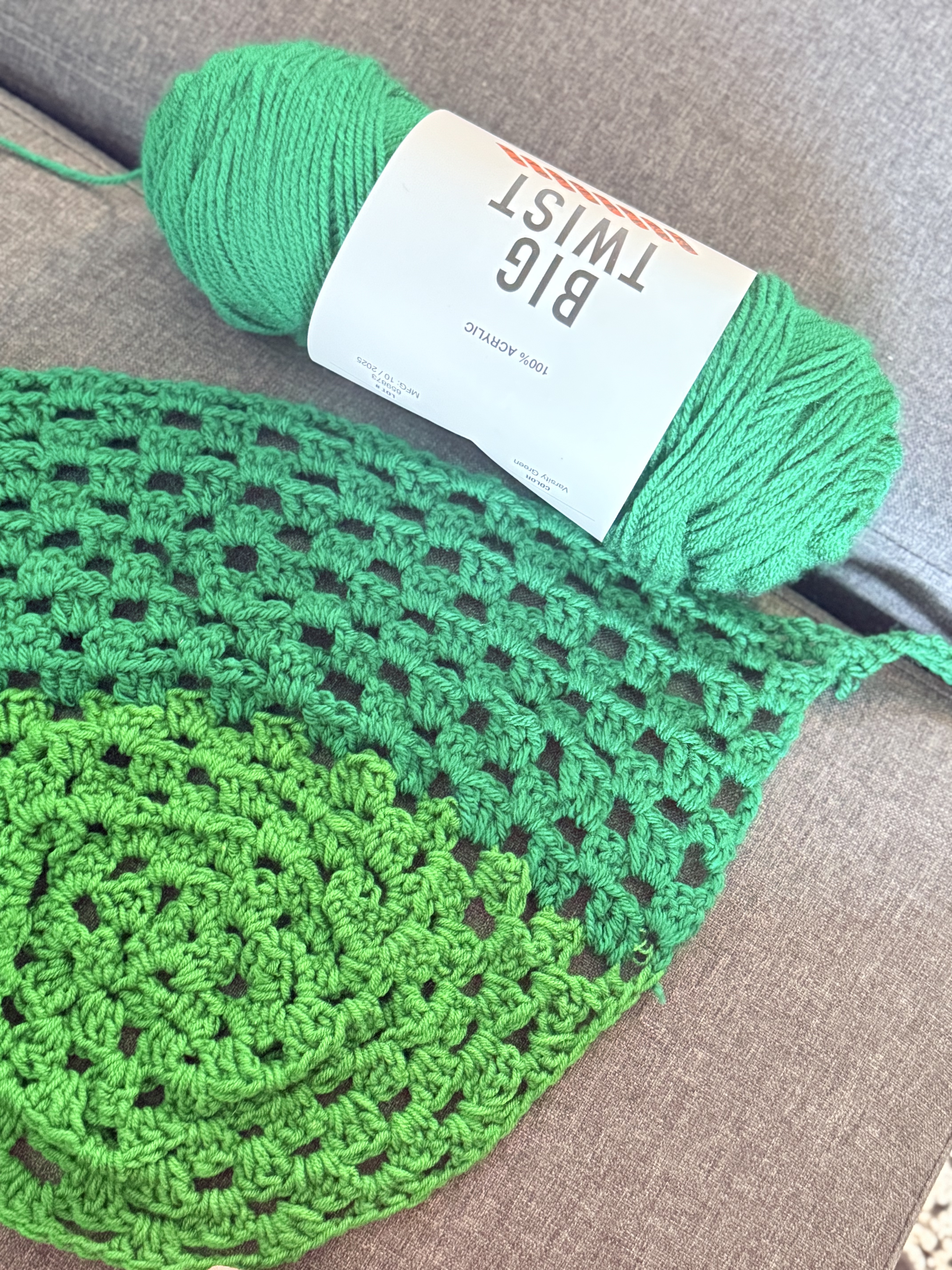 Green crochet bandana with yarn skein
