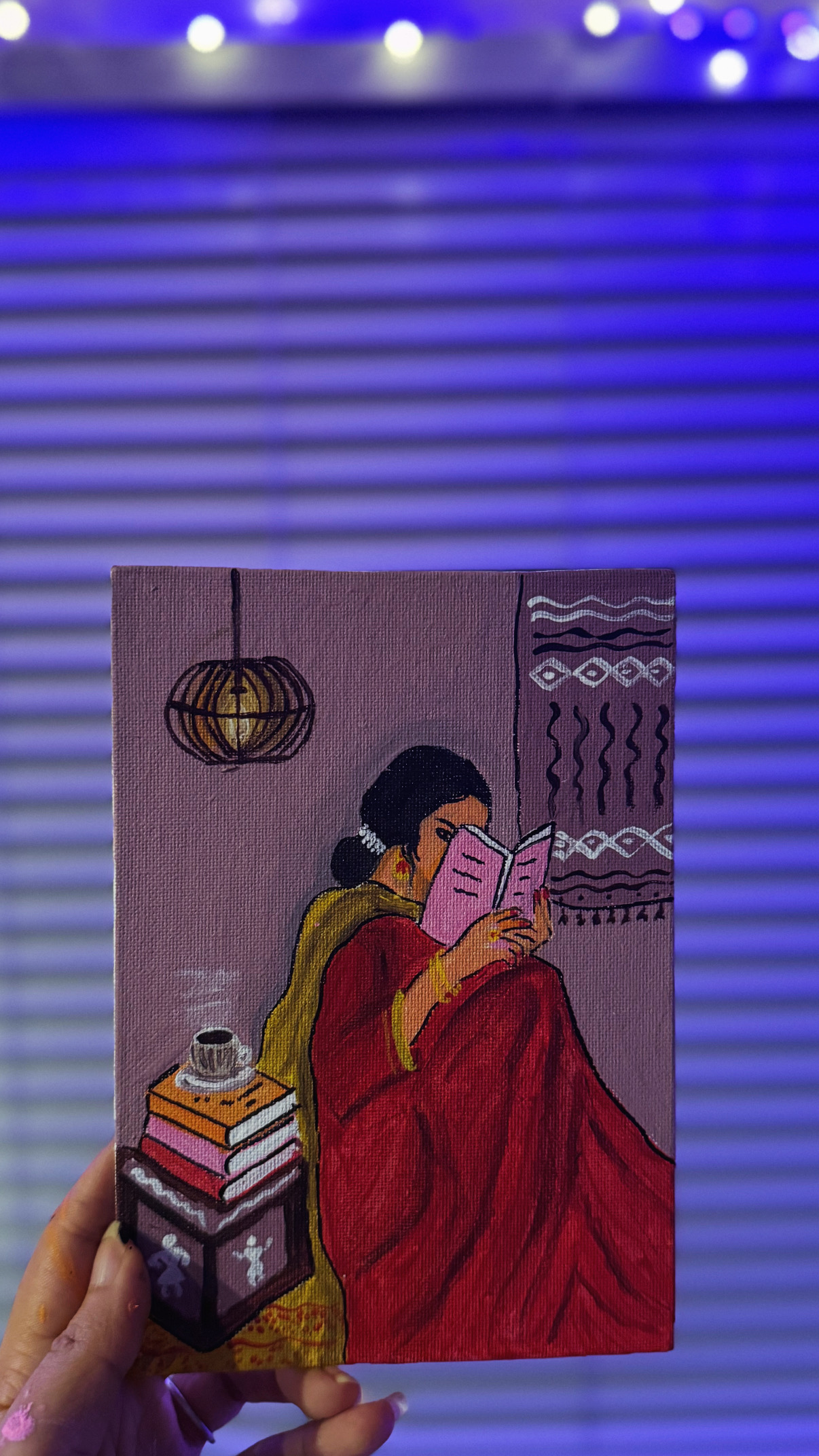 Lady reading while wrapped in a red shawl painting