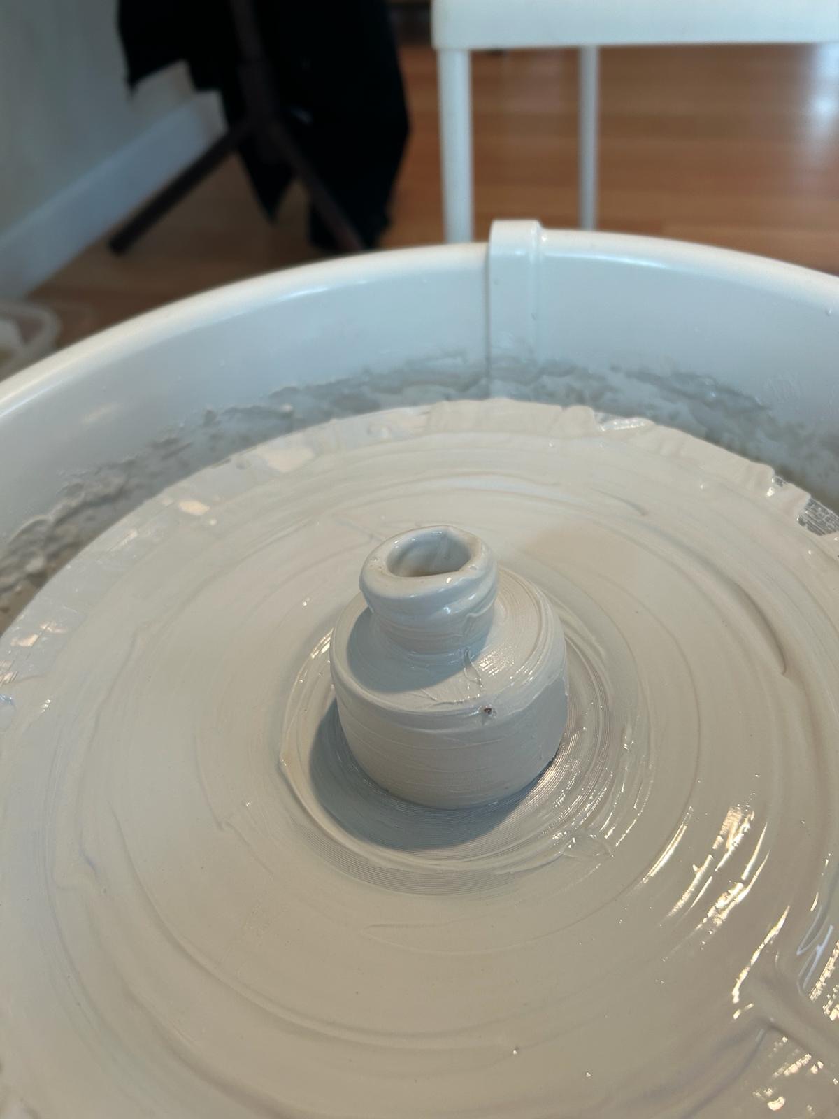 Clay centered on a pottery wheel